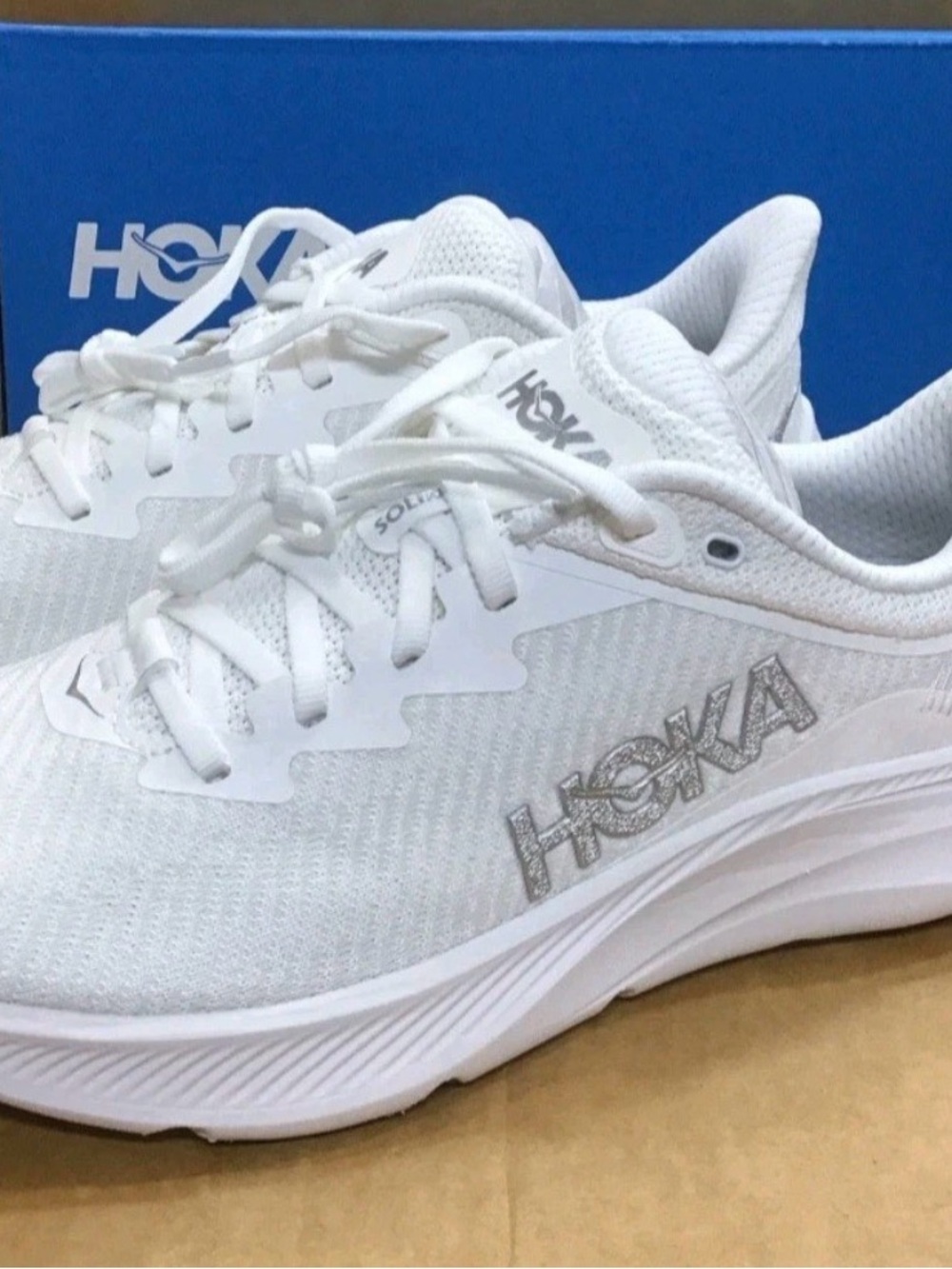 Hoka Women's White Athletic Running Shoes with Silver Logo